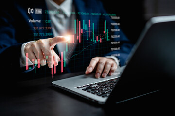 Businesswomen working analysis trading data virtual screens of graph stock market exchange on a...