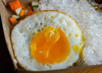 Shirataki low calorie rice choice with sunny side up egg. Meal for dinner or lunch with acar wortel timun or cucumber and carrots. Food photography isolated on horizontal ratio background.