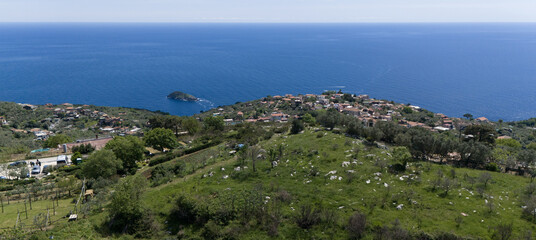 Sweeping view of a picturesque Amalfi coastal village panorama overlooking the sea with Isca shore...