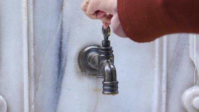 water pouring from a faucet tap outdoor in istanbul 