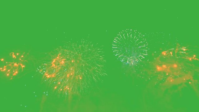 Colorful fireworks explode in the dark sky, creating a dazzling display of light and sparks