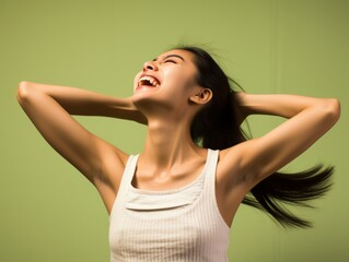 Fototapeta premium A woman with curly hair is smiling and laughing