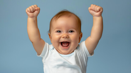 A baby is smiling and holding up his arms, looking happy and excited. Concept of joy and innocence, as the baby's expression and body language suggest that he is enjoying himself