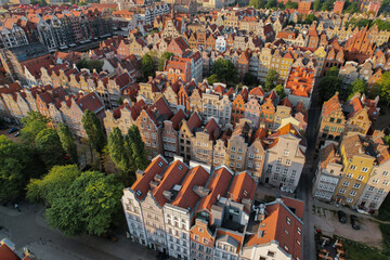 Beautiful panoramic architecture of old town in Gdansk, Poland at sunrise. Aerial view drone pov. Landscape cityscape City from Above. Small vintage historical buildings Europe Tourist 