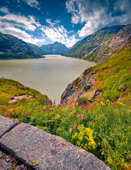 Stunning morning view of Grimselsee reservoir on the top of Grimsel pass. Spectacular summer scene...
