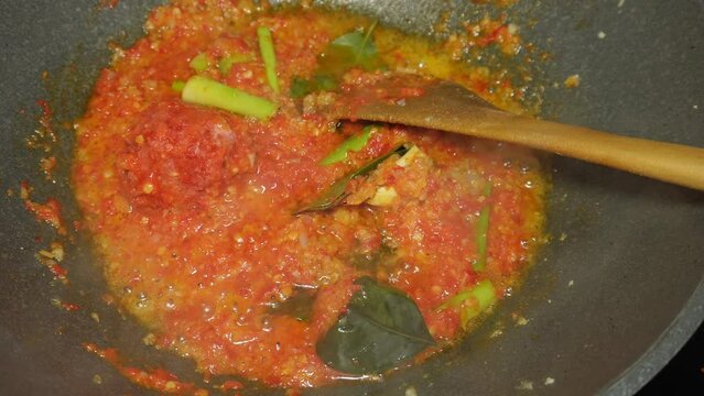 the process of cooking spicy spices or chili sauce, a homemade recipe for marinating chicken, fish, shrimp, or other proteins