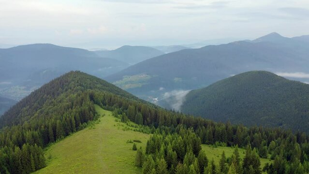 4k drone flight back footage (Ultra High Definition) of Yahidna mount. Marvelous summer view of Carpathian mountains, Ukraine, Europe. Beauty of nature concept background.