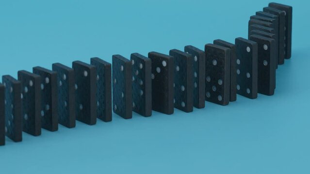 Domino effect, row of domino falling down on blue background.