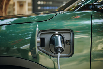 Plug inserted in electric car charge port