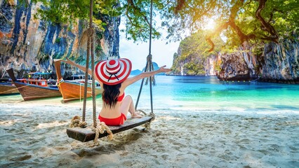 Woman bikini relaxing swing ko lao lading island krabi thailand
