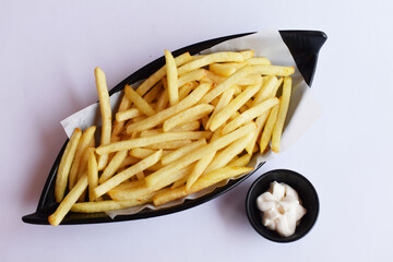 French fries diaplayed in black plate at Pune India