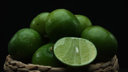 Macrography of sliced lime, vibrant citrus slice are meticulously arranged within a charming wooden...