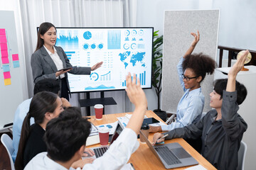 Diverse analyst team colleague raise hand, ask question on data analysis marketing during...