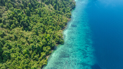 Aerial view of islands, Andaman Sea, natural blue waters and forests, tropical sea of Thailand. Beautiful scenery of the island with beautiful nature.	