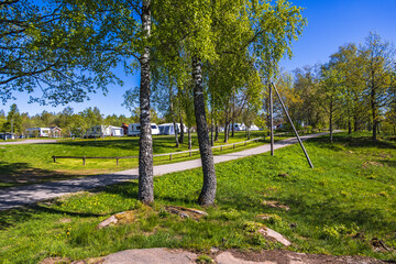 Camping Site with caravans in a tree grove - 791339418