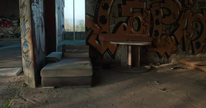 Discarded sofa amidst graffiti in a forsaken Zagreb hospital