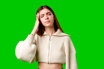 A woman is seen sitting with her head buried in her hands, appearing distressed or overwhelmed.