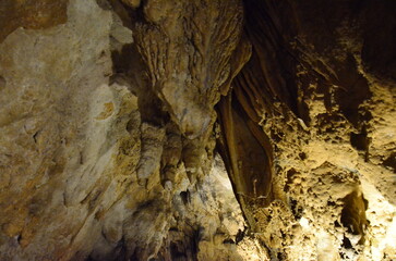 Creepy Underground cave. Eerie atmosphere inside the dark cave. Beams of light piercing through the darkness of the Underground cave 