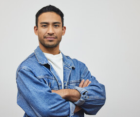 Confidence, man and portrait with arms crossed, fashion and modern style in a studio with smile....