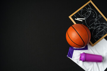 Basketball Strategy Planning With Chalkboard, Ball, and Jersey on Dark Background