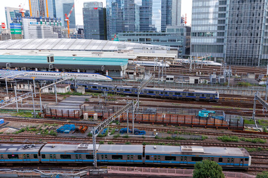 Shinkansen and commuter trains at the main railway train station in Tokyo, Japan