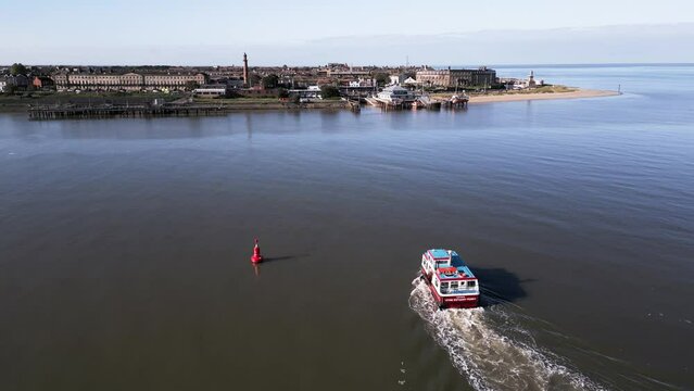 Aerial Drone Footage of Fleetwood to Knott End Ferry on Wyre Estuary. Fleetwood Skyline and Two Lighthouses in the background