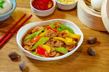 Chicken fried with bell pepper in sauce. Lunch. Chinese food.