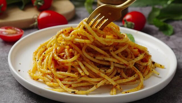 Traditional pasta spaghetti in plate on table.
