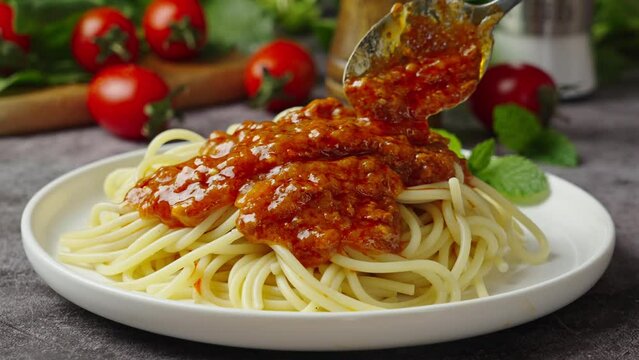 Traditional pasta spaghetti in plate on table.