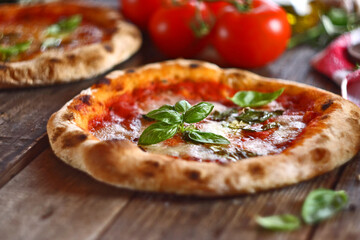 Neapolitan pizza with mozzarella, tomatoes and basil leaves.
Homemade pizza margherita. Selective...