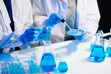 Fototapeta premium Scientist team meeting and writing analysis results in the laboratory study and analyze scientific