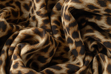 Close up of animal print fabric. Fashion texture for design of clothing