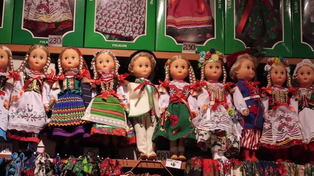Souvenirs, and traditional dolls at the market in the Krakow Cloth Hall, Poland.