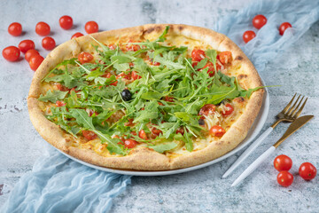 pizza with tomatoes and basil