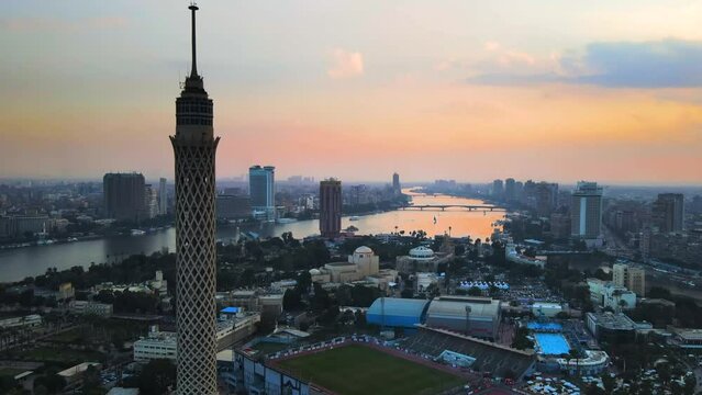 Aerial perspective of Cairo Tower, a solitary concrete structure in Cairo, Egypt, is passed by, illustrating the concept of urban prominence and architectural significance.