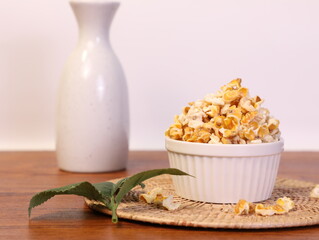 Popcorn for a plate and a cup of dipping sauce