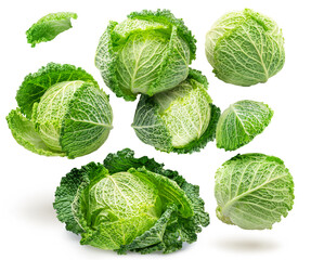 Fresh green savoy cabbages levitating in air on white background. File contains clipping paths.