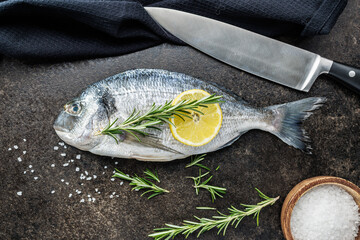 Fresh sea bream fish on kitchen table. Top view. - 791403222