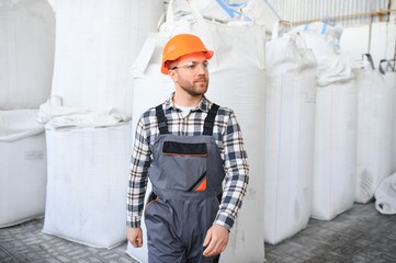 Portrait of factory worker. Young handsome factory worker