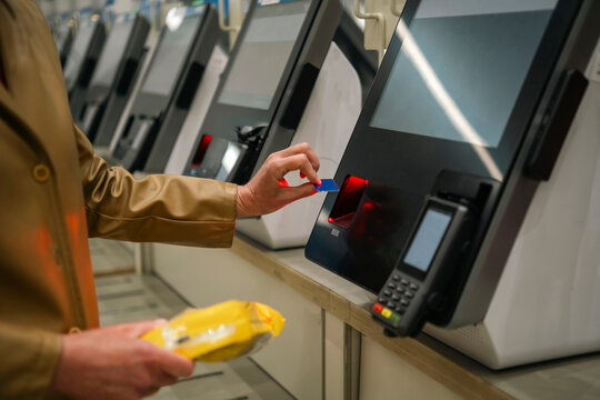 Young woman using infrared self kiosk service