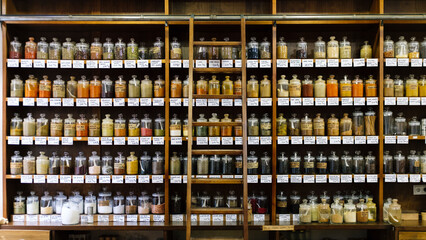 Variety of condiments jars arranged on shelves in departmental store