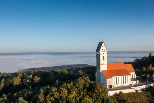 Germany, Baden-Wurttemberg, Offingen, Pilgrimage Church of St. John Baptist with thick fog in background