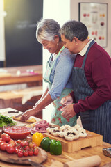 Cooking, vegetables and senior couple in kitchen at home with cutting ingredients for meal. Love, food and elderly man and woman preparing dinner, lunch or supper together at house in Mexico.