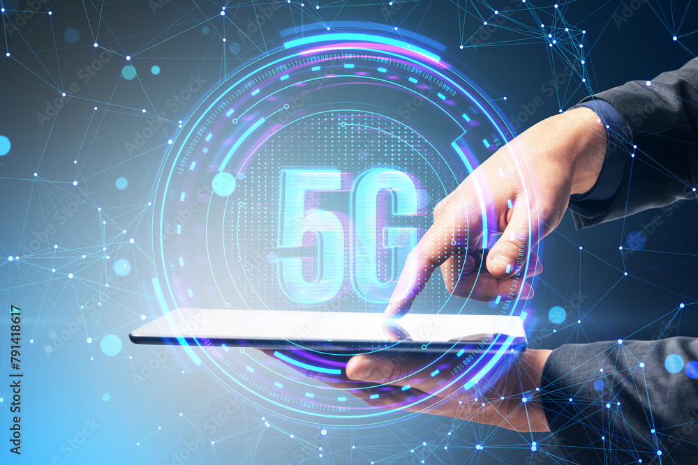 Poster close up of male hands using tablet with creative glowing polygonal 5g hologram on blurry background