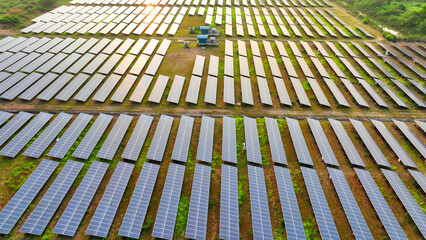 A rows of solar panels, aligned meticulously to capture sunlight efficiently. This sustainable...