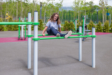 happy child playing sports on the playground during the day. High quality photo