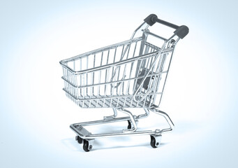 Small shopping cart isolated on solid background