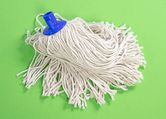 Simple new mop isolated on green background