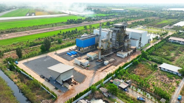 Utilizing methane from decomposing waste, this landfill power plant converts gas into electricity, powering homes sustainably. Drone aerial view.
