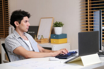 Man working with computer at home office at night, Working at home, Online learning education
